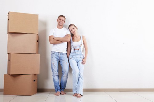 Removals team planning a move in a busy Soho street