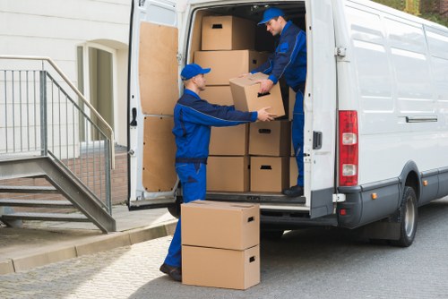 Loading household and office items into a removal truck in Soho