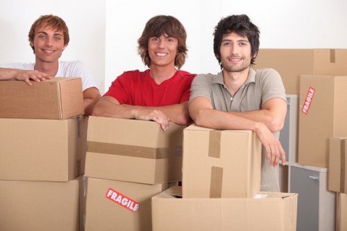Careful transport of household furniture through a Soho building entrance