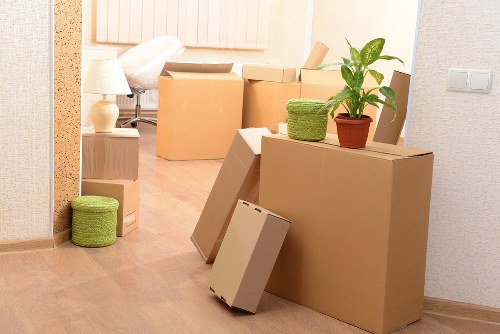 Packed office equipment prepared for transport during a Soho relocation